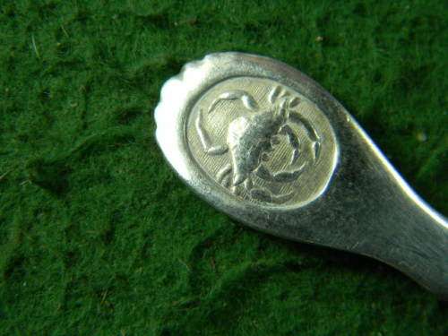 2 very oldflower spoons with an crab at back brass and silver plated as per pictures