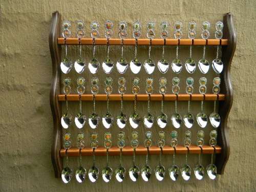 36 Souvenir (36 with charms 12 S.A ) spoons as per pictures  spoons in good condition with free rack