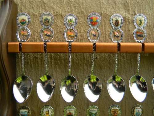 36 Souvenir (36 with charms 12 S.A ) spoons as per pictures  spoons in good condition with free rack
