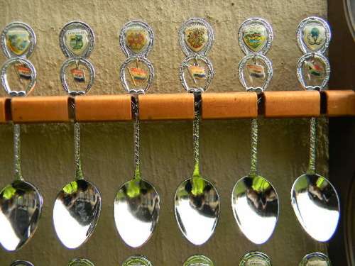 36 Souvenir (36 with charms 12 S.A ) spoons as per pictures  spoons in good condition with free rack