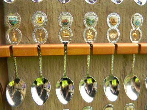 36 Souvenir (36 with charms 12 S.A ) spoons as per pictures  spoons in good condition with free rack