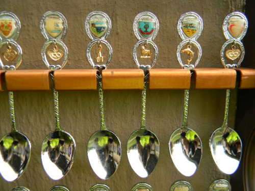36 Souvenir (36 with charms 12 S.A ) spoons as per pictures  spoons in good condition with free rack