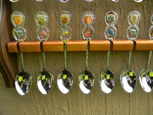 36 Souvenir (36 with charms 12 S.A ) spoons as per pictures  spoons in good condition with free rack