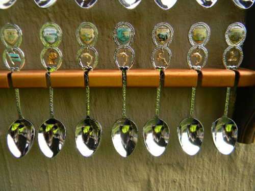 36 Souvenir (36 with charms 12 S.A ) spoons as per pictures  spoons in good condition with free rack