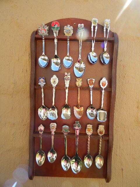 18 Souvenir  spoons  in good condition with free rack  as per pictures