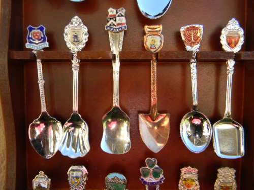 18 Souvenir  spoons  in good condition with free rack  as per pictures