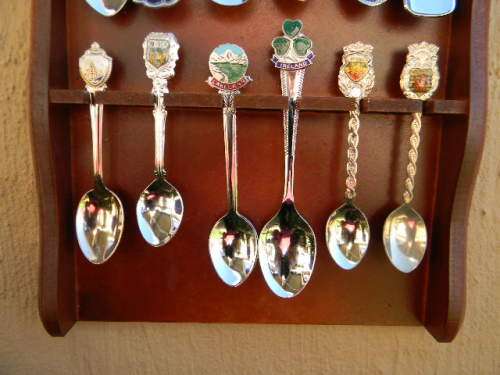 18 Souvenir  spoons  in good condition with free rack  as per pictures