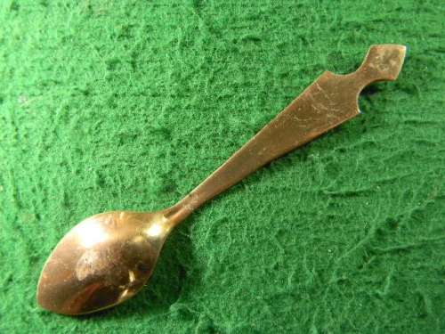 Kariba spoon yellow copper plated  in fair  condition  As per pictures