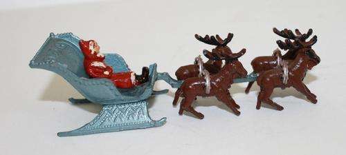 Santa in Sleigh and Reindeer...Made in England..11cm Long..Die Cast.
