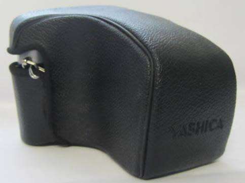 **Yashica FX-7** Yashica ML Zoom 42-75mm 1:3.5-4.5 Lens..Incl UV Haze Filter and Bag