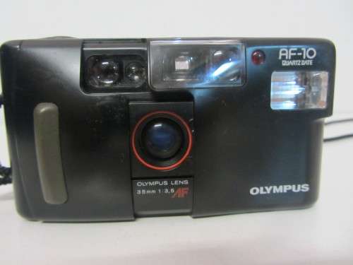 **Olympus AF-10**35mm Film Camera Olympus 35mm 3.5 Lens-AF/Self Timer Quartz Date