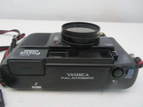 **Yashica Auto Focus**35mm Camera..Good Cosmetic Condition...Flash not firing..Shutter Fires.