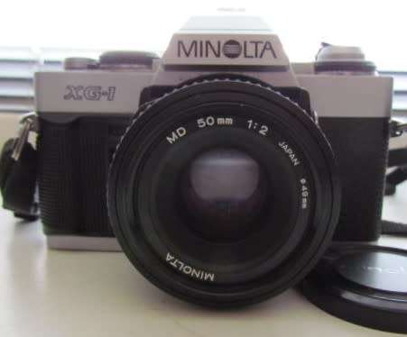 **Minolta XG-1**Minolta MD 50mm 1:2 Lens Plus Panagor PMC Auto Zoom f=3.5 100mm Lens.