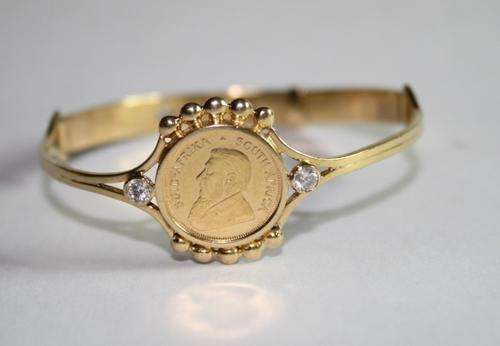 Kruger Rand 1/10 set in 18ct gold bracelet