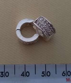 PAIR OF CLUSTER WHITE CZ HUGGIE EARINGS SET IN STERLING SILVER