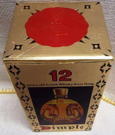 SUPER RARE ,,12 YEARS OLD DIMPLE sealed bottle ,,,BOTTLED IN THE 1970s,