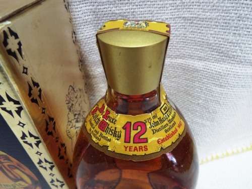 SUPER RARE ,,12 YEARS OLD DIMPLE sealed bottle ,,,BOTTLED IN THE 1970s,