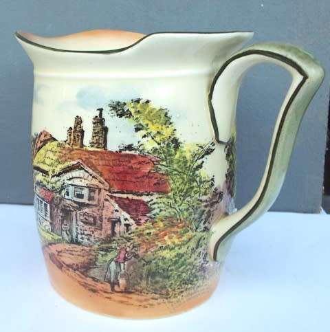 RARE .... Royal Doulton series ware milk jar  decorated with cottage scenes against a lemon yellow