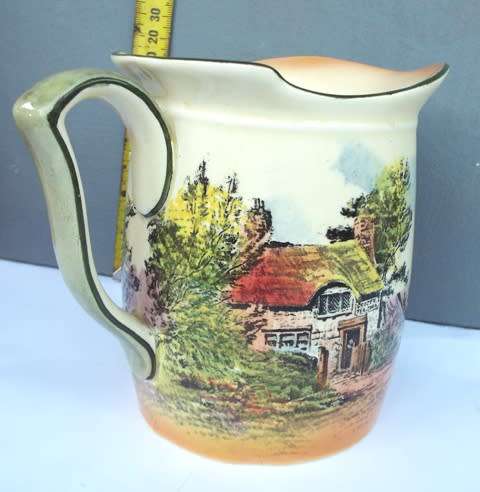 RARE .... Royal Doulton series ware milk jar  decorated with cottage scenes against a lemon yellow
