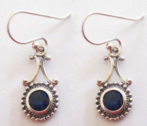 A PAIR OF SOLID SILVER EARRINGS WITH A COBALT BLUE STONE