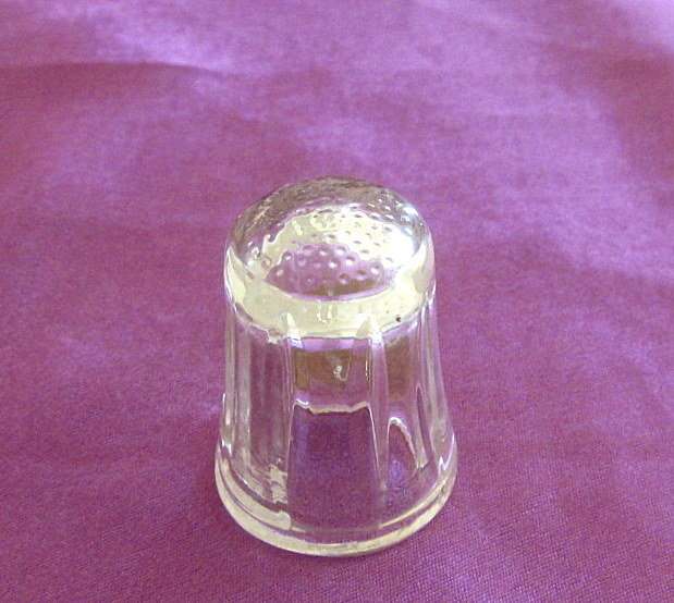 A CLEAR GLASS THIMBLE