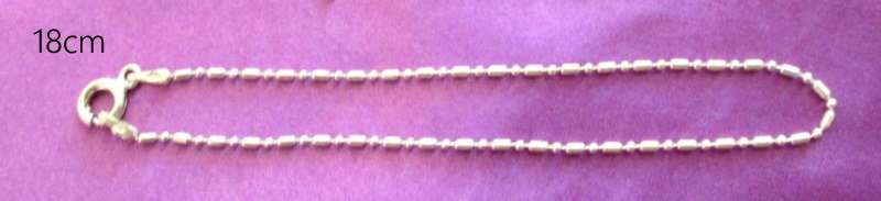 A SOLID SILVER BRACELET CHAIN AND 3 SOLID SILVER CHARMS---NEW