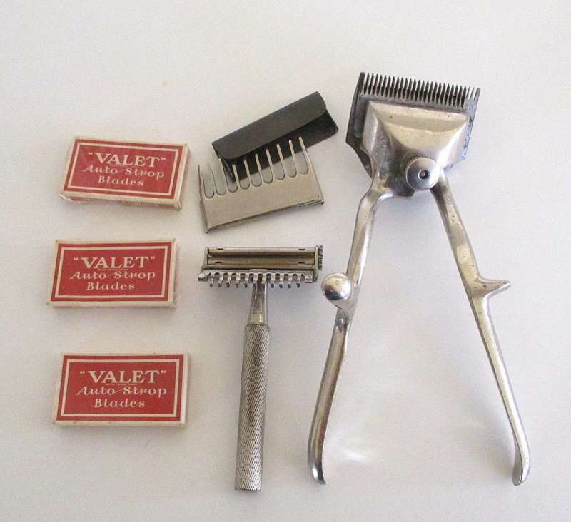 AN AUTO  STROP SAFETY RAZOR WITH BLADES AND A HAIR CUTTER