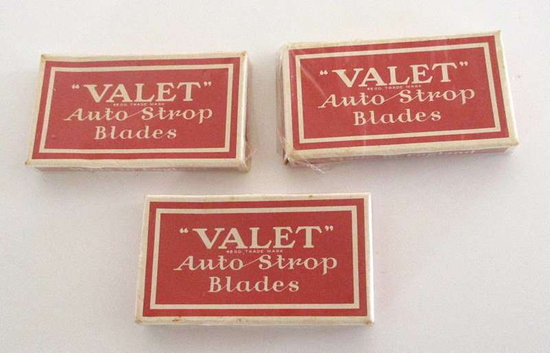 AN AUTO  STROP SAFETY RAZOR WITH BLADES AND A HAIR CUTTER