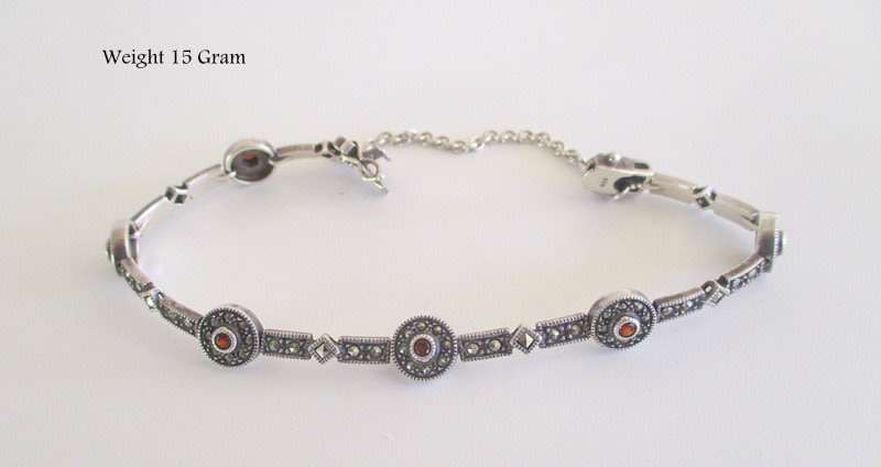 A STUNNING SOLID SILVER GARNET AND MARCASITE BRACELET--Weight 15gram