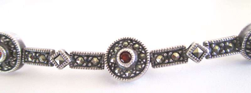A STUNNING SOLID SILVER GARNET AND MARCASITE BRACELET--Weight 15gram