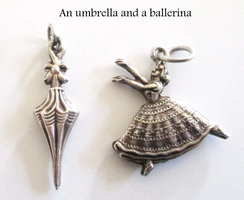 A LOT OF SOLID SILVER CHARMS---23,6 Gram