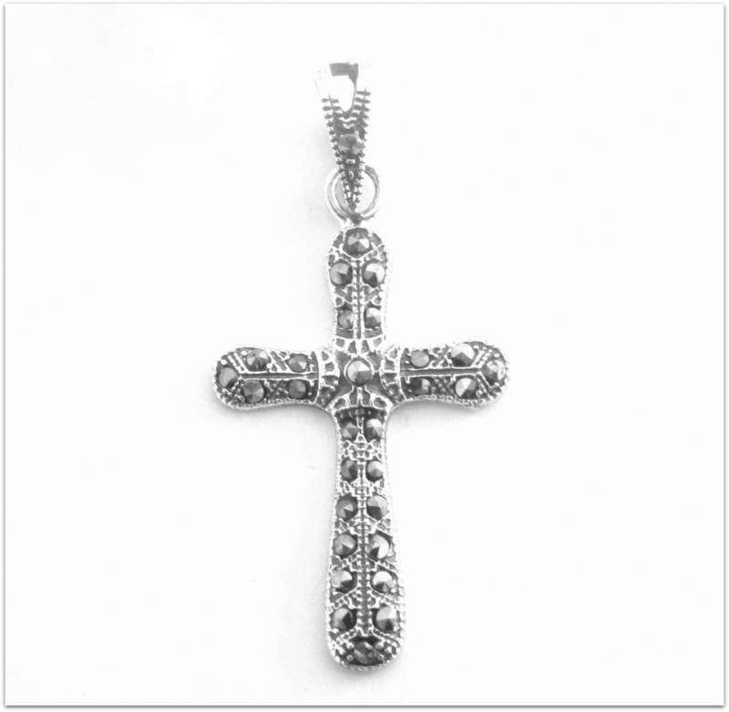 A SOLID SILVER MARCASITE CROSS
