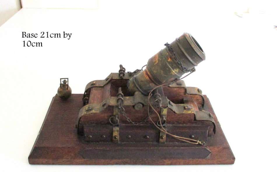 A WOOD AND BRASS REPLICA CANON