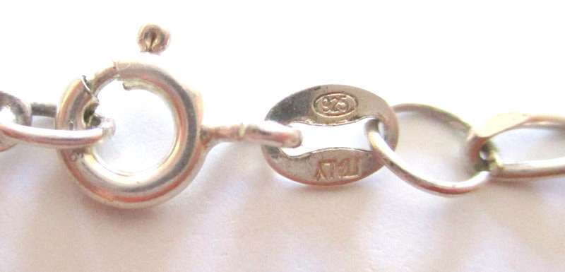 A SOLID SILVER CHARM BRACELET