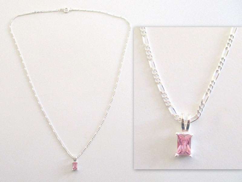 AN ATTRACTIVE DAINTY SOLID SILVER PENDANT WITH A PINK STONE ON A SOLID SILVER CHAIN---NEW