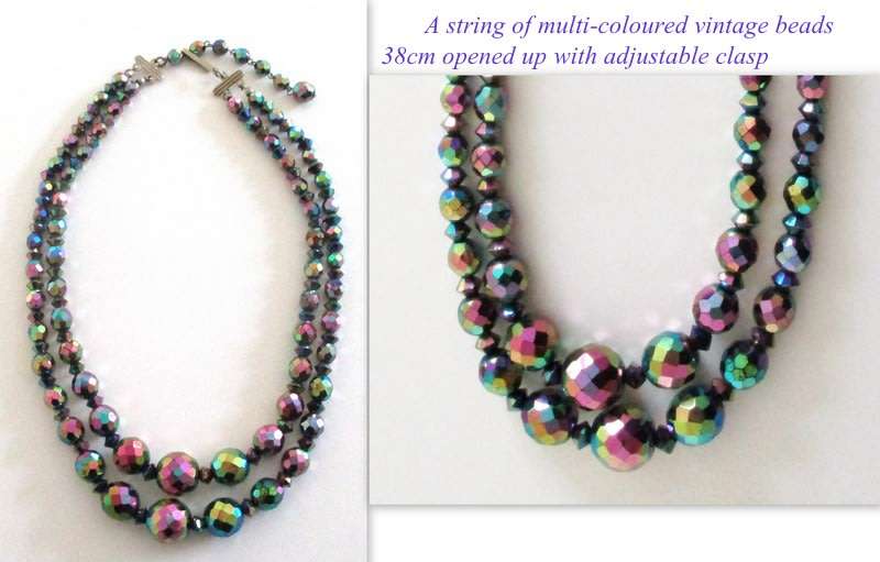 A VINTAGE 2 STRING MULTI-COLOURED CRYSTAL BEADED NECKLACE
