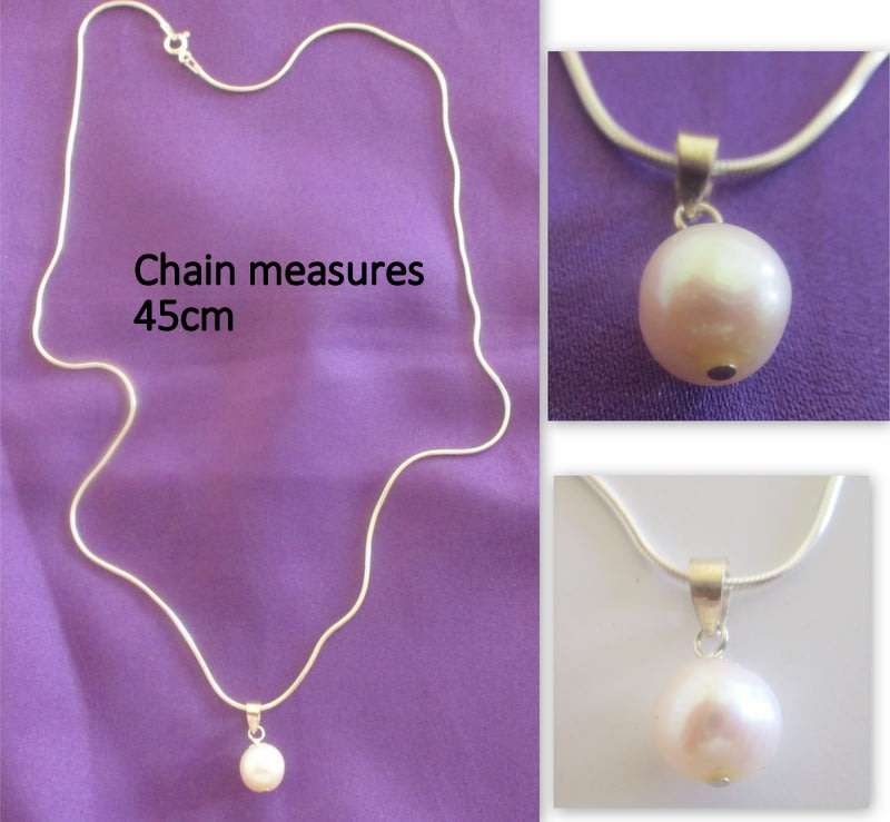 A GENUINE DAINTY FRESH WATER PEARL SET IN SILVER ON A SILVER SNAKE CHAIN---NEW