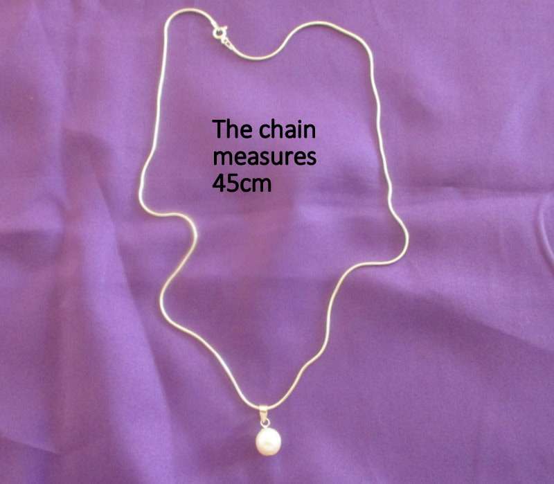 A GENUINE DAINTY FRESH WATER PEARL SET IN SILVER ON A SILVER SNAKE CHAIN---NEW