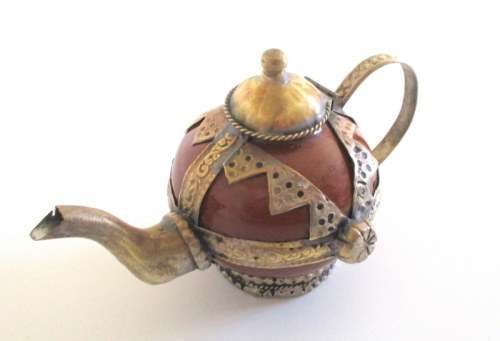 A METAL AND CERAMIC TEA POT AND A POTTERY TEA POT