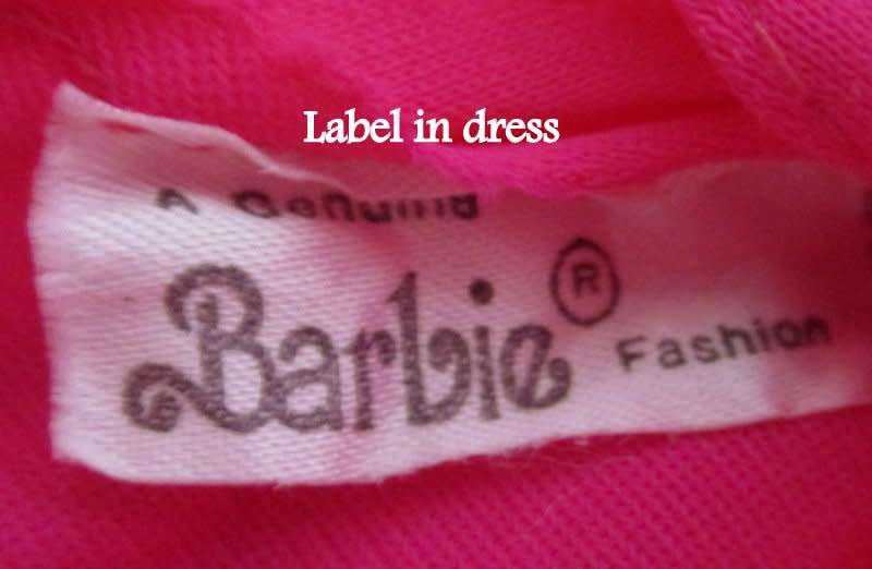 A 1990 Barbie doll with original barbie dress