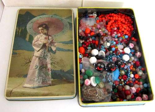 GOOD GOLLY MISS MOLLY AND A VINTAGE TIN FULL OF VINTAGE GLASS BEADS.INCLUDING CORAL