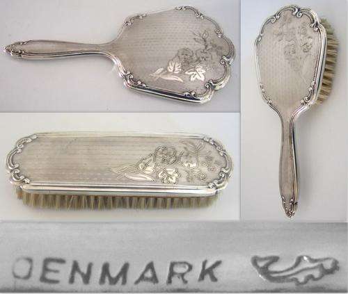 A HANS JENSEN SILVER PLATED DRESSING TABLE SET EMBOSSED WITH FLOWERS AND LEAVES--NOTE