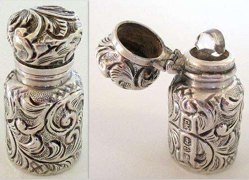 A DELIGHTFUL VICTORIAN MINIATURE HALLMARKED SILVER PERFUME BOTTLE--DATED 1888