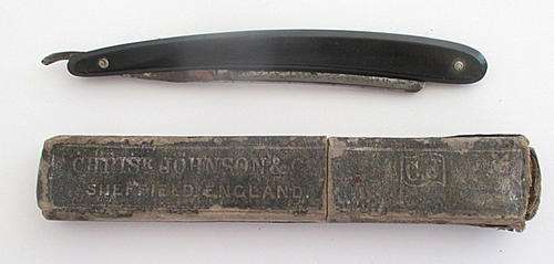 A CUT THROAT RAZOR MADE IN SHEFFIELD