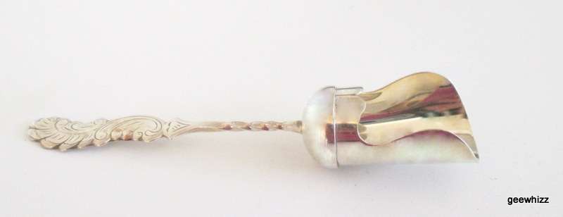 A SILVER PLATED SUGAR SCOOP