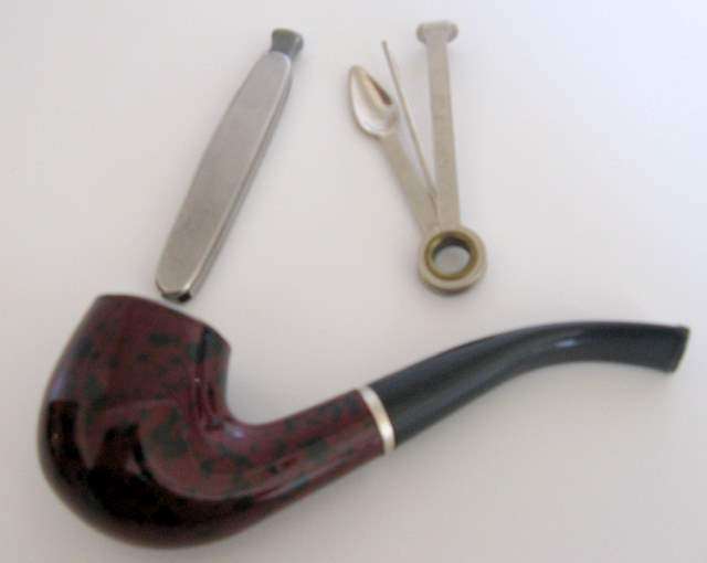 A PIPE , PIPE CLEANER AND POCKET KNIFE