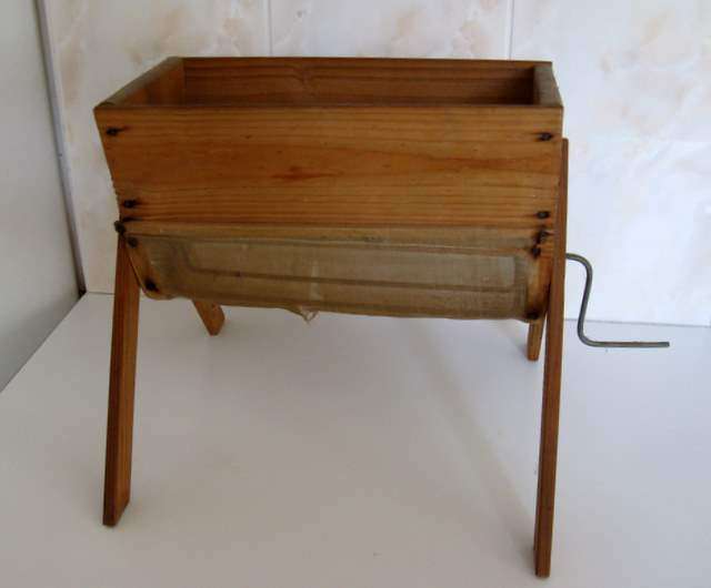 AN OLD WOODEN FARM FLOUR SIEVE