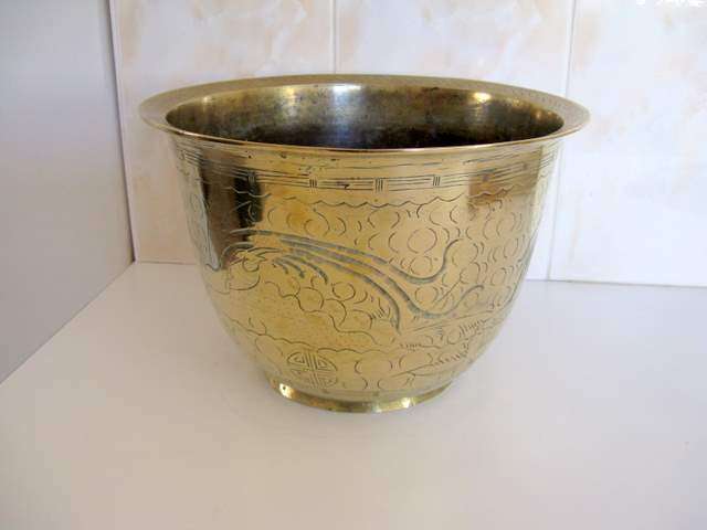 A CHINESE BRASS POTPLANT HOLDER