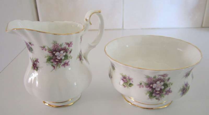 A SMALL ROYAL ALBERT "SWEET VIOLETS" SUGAR BASIN AND CREAMER