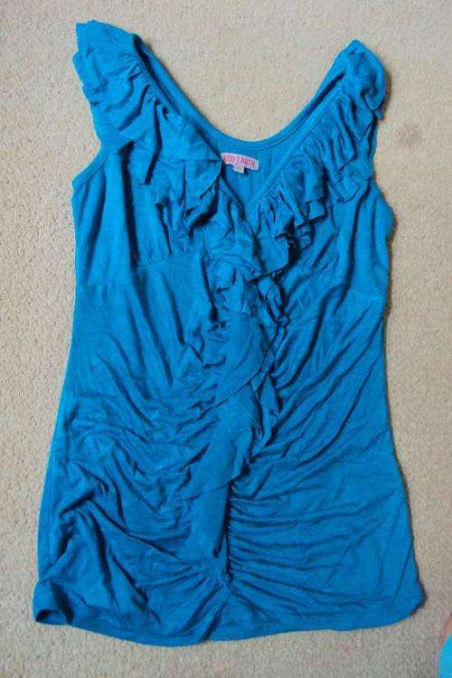 red earth - blue top